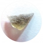 Very small moldavite in microscope