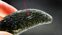 A moldavite with an unusual kind of damage